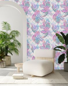 a white chair sitting next to a potted plant