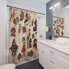 a bathroom with a large shower curtain covered in tattoos