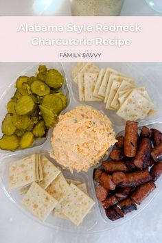 a plate with crackers, cheese and pickles on it