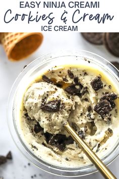 an ice cream in a glass bowl with chocolate chips and oreo cookies on the side