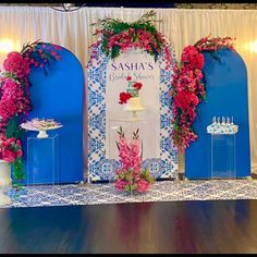 the stage is decorated with flowers and candles for a wedding reception at saiha's