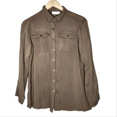 Yidarton Shirt In Olive Green. From A Huge Collection Of Unworn And Lightly Worn Wardrobe Obtained From A Major Studio Costume Department. Clothing From Shows Including Disney + Shows Big Shot With John Stamos, The Mighty Ducks: Game Changers With Emilio Estevez, Lauren Graham And Josh Duhamel, Apple Tv Series Truth Be Told, Amazon Series Daisy Jones And The Six, With Love, Hit Hulu Series Saint X, Tiny Beautiful Things, Good Trouble, How I Met Your Father, Hulu Film Quiz Lady, 2023 White Men Ca Khaki Button-up Shirt For Work, Brown Button-up Blouse With Pockets, Khaki Button-up Blouse For Fall, Khaki Button-up Workwear Blouse, Khaki Button-up Blouse For Work, The Mighty Ducks Game Changers, Mighty Ducks Game Changers, Tiny Beautiful Things, Film Quiz