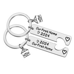 two personalized keychains with hearts and arrows are shown on a white background