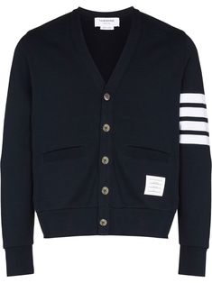 4-Bar logo-patch cardigan from THOM BROWNE featuring navy blue, white, cotton, signature 4-Bar stripe, logo patch to the side, V-neck, front button fastening and long sleeves. Thom Browne Cardigan, Patch Cardigan, Bar Logo, Thom Browne, Patch Logo, Navy Blue, V Neck, Bar, Boutique