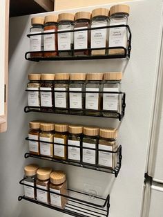 the spice rack is filled with many different kinds of spices