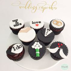 wedding cupcakes are arranged on a plate with the words i do and love