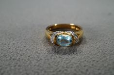 I am offering you this fabulous vintage sterling silver,with yellow gold overlay (stamped) wedding band stacker design ring. This piece is distinctive and stunning with the following features: It features 11 total combination prong and bezel set round and oval shaped genuine blue topaz and diamond stones. These stones are set in a raised relief multi stone design setting. What a fantastic Art Deco style ring we have here. It is currently a size 7, though it is could be sized up or down. It weigh Gold Topaz Ring With Accent Stones For Anniversary, Elegant Oval Topaz Ring For Anniversary, Classic Gold Topaz Ring With Diamond Accents, Classic Gold Topaz Ring With Accent Stones, Gold Oval Topaz Ring With Center Stone, Formal Oval Topaz Ring Stamped 14k, Gold Oval Topaz Ring Stamped 14k, Oval Topaz Ring Stamped 14k For Formal Occasions, Classic Topaz Ring With Diamond Accents For Anniversary