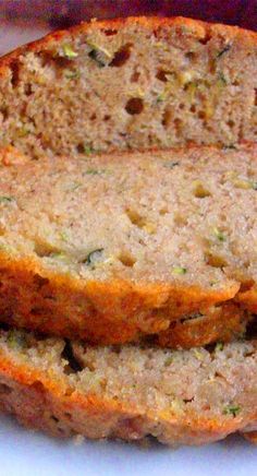 two slices of zucchini bread on a white plate