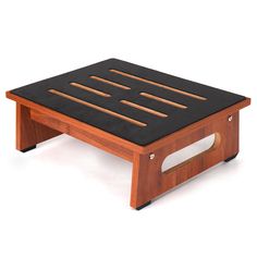 a wooden coffee table with black top and wood slats on the bottom, in front of a white background