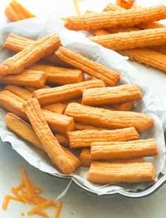 cheetos are sitting in a basket on the table