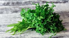 fresh green parsley on a wooden surface