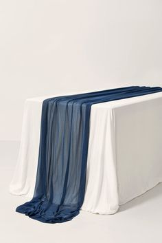 a white table topped with a blue cloth