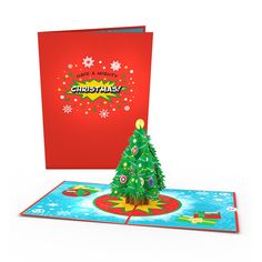 a pop up christmas card with a tree on the bottom and an ornament in the middle