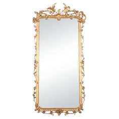 an ornate gold framed mirror on a white background