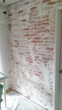 a room that has a brick wall in it