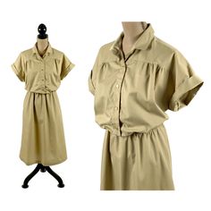 "This vintage 70's khaki short sleeve button up has an elastic gathered shirtwaist and a full a-line skirt with a single side seam pocket. The dress is an unlined poly/cotton blend and is from Sears \"The Fashion Place\". This collared dress has buttons to the waist, is a longer length midi with a retro 50's housewife vibe! MEASUREMENTS: Armpit to armpit - 20 inches Bust fits up to - 40 inches Waist - 28 inches up to 38 inches Hips - 46 inches Length - 46 inches Modern size: Large Label marked s 1970s Clothes, Long Black Pencil Skirt, 50's Housewife, 1970s Clothing, Market Day, Shirtwaist Dress, Collared Dress, Lace Jacket, Clothes Women