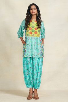 Turquoise chanderi kurta featuring animal and abstract floral geometric print, embellished by sequins. - Aza Fashions Blue Bohemian Salwar Kameez With Bandhani Print, Festive Silk Kurta With Ikat Print, Festive Blue Ikat Print Kurta, Festive Turquoise Silk Set, Blue Ikat Print Kurta For Festive Occasions, Festive Ikat Print Chanderi Sets, Blue Bandhani Print Sets For Summer, Blue Bandhani Print Summer Sets, Summer Blue Bandhani Print Sets