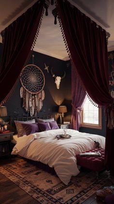 a large bed sitting in a bedroom next to a window with drapes on it