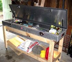 an open toolbox sitting on top of a workbench