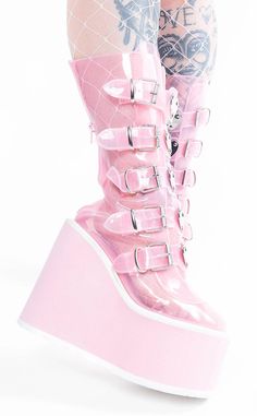 A pretty pair for the babes who wear their hearts on their sleeves! The SWING-230C translucent mid-calf boots are tinted an adorable baby pink and feature 5 heart plated-straps on top of a matching wedge platform. The boots secure with a rear zip for easy on/off. The SWING series features a 5 1/2 inch platform wedge. Material: Tinted PU. 100% Vegan. US women's sizing - refer to size chart for more info Please note: these shoes are in our warehouse, ready to ship. If your size isn't available, you can preorder a pair here. Boots Demonia, Punk Festival, White Platforms, Demonia Boots, Light Aesthetic, Demonia Shoes, Goth Punk, Girly Shoes, Platform Wedge