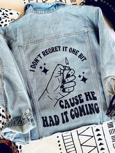 a jean jacket that says don't forget it one bit cause he had it coming