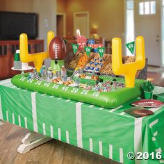 an inflatable football table with snacks and decorations