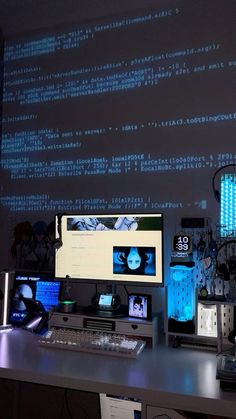 a computer desk topped with two monitors next to a keyboard and mouse on top of a table