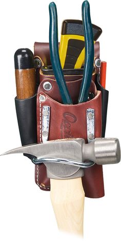 a knife holder with many different tools in it