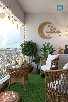 the balcony is decorated with wicker furniture and lights on it's windowsill