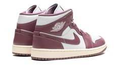 The Women’s Air Jordan 1 Mid "Sky J Mauve" is a women’s-exclusive colorway of the lifestyle shoe with an eye-pleasing look.  The popular Jordan 1 Mid seen here features a light grey leather base with Sky J Mauve-colored leather overlays and leather Swoosh branding.  A classic “Wings” logo can be found on the collar while a Jumpman appears on the tongue tag.  Underfoot, an off-white rubber midsole and Sky J Mauve rubber outsole complete the look.  Release date: October 21, 2023 Mauve Outfit, Mauve Shoes, Jordan New, Wings Logo, October 21, Stadium Goods, Air Jordan 1 Mid, Jordan 1 Mid, Colored Leather