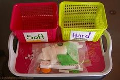 three plastic baskets with different items in them sitting on a tray that says soft and hard