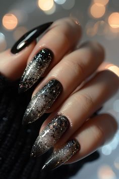 Embark on a cosmic journey with black nails adorned with mesmerizing silver galaxy designs, capturing the beauty of the universe at your fingertips. Each swirl of silver against the dark background creates a sense of depth and wonder, making these nails truly out-of-this-world. Click for more! Black And Silver Christmas Nails, Black Nails Sparkle, Dark Silver Nails, Black And Glitter Nail Designs, Silver Black Nails, Dark Christmas Nails, Black Nails With Silver, Black Summer Nails, Black And Silver Nails