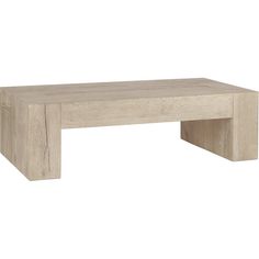 a wooden table sitting on top of a white floor