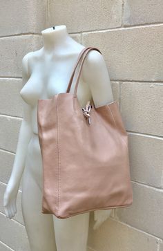 Large tote leather bag in PINK. Soft pastel shade shoulder bag. Natural GENUINE leather. Large enough for books or a laptop, tablet, cosmetics bag etc. Pink leather shopper. The inside of the bag is not lined (although properly finished!) . We added a small leather pouch on the inner part of the bag The bag can be closed by 2 leather straps attached to each side. Excellent quality soft but strong genuine leather. Width upper part: 41cm - 16 inch Height: 38 cm - 15 inch (CAMEL COLOR AS ON THE FIR Modern Blush Bag For Everyday Use, Blush Bag With Removable Pouch For Everyday, Modern Pink Bag For Everyday Use, Pink Soft Leather Satchel Shoulder Bag, Pink Double Handle Shoulder Bag For Everyday, Rectangular Pink Soft Leather Shoulder Bag, Pink Rectangular Shoulder Bag For Everyday, Everyday Pink Canvas Shoulder Bag, Blush Rectangular Bag For Daily Use