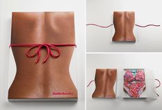 the back of a woman's body is wrapped in brown paper and tied with red string