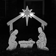 a black and white photo of a nativity scene