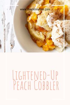 a white bowl filled with food on top of a wooden table next to a sign that says, lightened - up peach cobbler