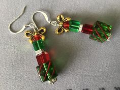 Adorable stacked square glass Christmas gifts with mixed metal & gold bow on top. Green with red stripes, solid green & solid red, with silver rhinestone spacer beads & a tiny red diamond crystal. Perfect accessory for that Christmas party outfit! Christmas Packages, Lampwork Bracelets, Christmas Party Outfit, Bead Projects, Christmas Bead, Solid Green, Christmas Packaging, Red Diamond, Solid Red