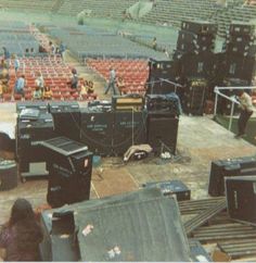 an empty stadium filled with lots of black boxes