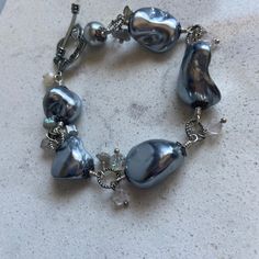 "Hand made Silver Baroque Pearls original design hand wired gray silver tone jewelry bracelet one of a kind OOAK I used the prettiest large gray baroque pearls for this bracelet. All hand made by me.   bracelet is 8\" long , adjustable   Please click on ZOOM below the photo for a huge closeup! Thanks for visiting my shop! Ask for the discounts if buying more than one lot Please check my other Etsy shop AnnaGraceDreams for vintage jewelry and one of a kind creations made by me.  https://www.etsy.com/shop/AnnaGraceDreams  Also please check my blog for updates at AnnaGraceDreams.com" Jewelry Bracelet, Baroque Pearls, Arm Band, Original Design, Original Designs, Vintage Jewelry, Silver Tone, Jewelry Bracelets, Hand Made