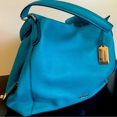 Beautiful Summer Turquoise Genuine Coach Leather Bag. Barely Used, Like New. Only Subtle Blemishes Are On The Bottom Corners. Elegant Turquoise Bag With Removable Pouch, Elegant Turquoise Shoulder Bag For Shopping, Elegant Turquoise Bag For Formal Occasions, Elegant Turquoise Leather Bag, Elegant Turquoise Shoulder Bag, Elegant Turquoise Tote Shoulder Bag, Chic Turquoise Leather Bag, Chic Turquoise Shoulder Bag With Removable Pouch, Chic Turquoise Shoulder Bag For Shopping