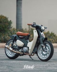 a black and white motorcycle parked in a parking lot