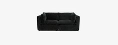 a black couch sitting on top of a white floor