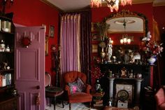 a living room filled with lots of furniture and decor