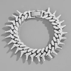 "Spiked Up": This edgy mini set consists of a 24 inch necklace and an 8 inch bracelet. Both are Cuban Link style and are encrusted with white rhinestones. Insertable and secured clasp. Ideal for any gender! Sold as a mini set (one necklace and one bracelet) White Iced Out Chain Link Jewelry, Iced Out White Chain Link Jewelry, White Cuban Link Party Jewelry, White Bling Bracelet, Silver Spiked Bracelets For Parties, Cuban Necklace, Real Gold Chains, Hip Hop Chains, Cuban Chain Necklace