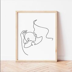 a line drawing of a woman holding a baby