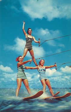 three women on water skis in the middle of an advertisement for kitesurfing