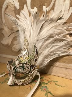 "This mask with feathers belongs to our collection of masks \"Lady Plumes\". The fetaher masks are the most elegant, refine and stunning masks of our collections. This mask is a traditional and original papier-mache Venetian mask, handmade and decorated in our Atelier in Venice using velvet , fabrics, Swarovski, feathers, different trimming. It is perfect for any masquerade party, Halloween costume, pro or event in Venice or elsewhere during Carnival. This mask can be gently bent to form to your Feathered Masquerade Mask, Venetian Outfit, Victorian Masks, Maskerade Masks, Masquerade Mask Aesthetic, Venetian Masks Art, Mask Venice, Mask With Feathers, Drawn Mask