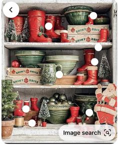 a shelf filled with lots of christmas dishes and other holiday decor on top of it