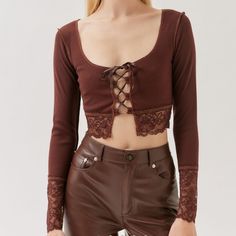 Brown Lace Long Sleeve Crop Top. Cropped Uo Top With Lace-Trim At The Cuffs And Hem. Hits Above The Waist In A Slim-Fit With A Scooped Neckline. Complete With An Open Lace-Up Detail At The Front. Selling The Brown But Fits Just Like The White Top. - 76% Polyester, 20% Rayon, 4% Spandex #Urbanoutfitters #Brown #Lace #Crop #Top Trendy Cottage Core Fairy Core Elegant Mermaid Core Frolicking Coquette Whimsical Ballet Core Fall Cropped Tops With Lace Trim, Fitted Brown Top With Lace Trim, Urban Outfitters Tops With Lace Trim For Spring, Fitted Trendy Crop Top By Urban Outfitters, Chic Fall Crop Top From Urban Outfitters, Urban Outfitters Brown Crop Top For Spring, Chic Urban Outfitters Crop Top For Fall, Fitted Urban Outfitters Crop Top For Fall, Brown Lace Shirt